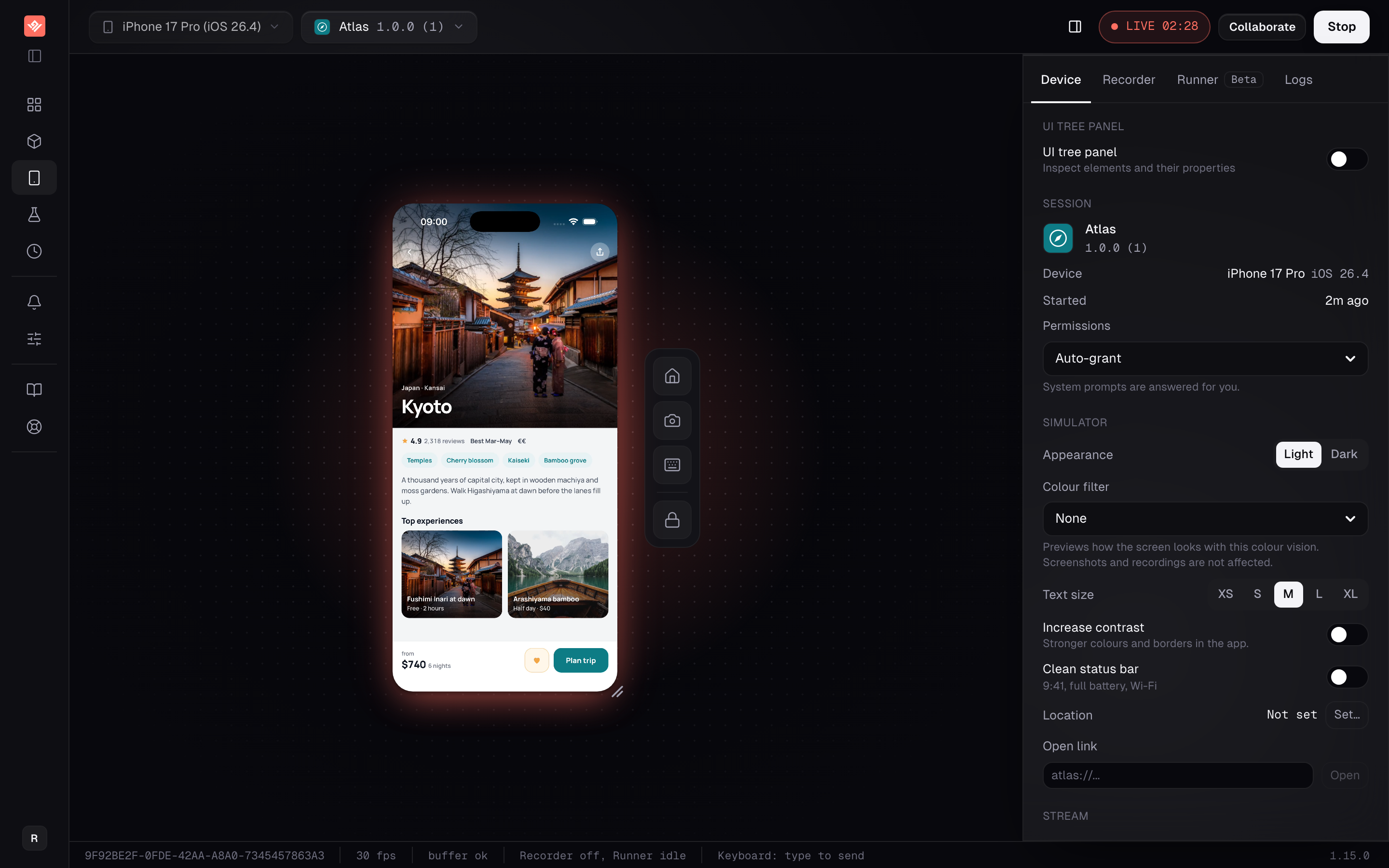 An iPhone simulator running live in the sandbox, with the control rig beside the device